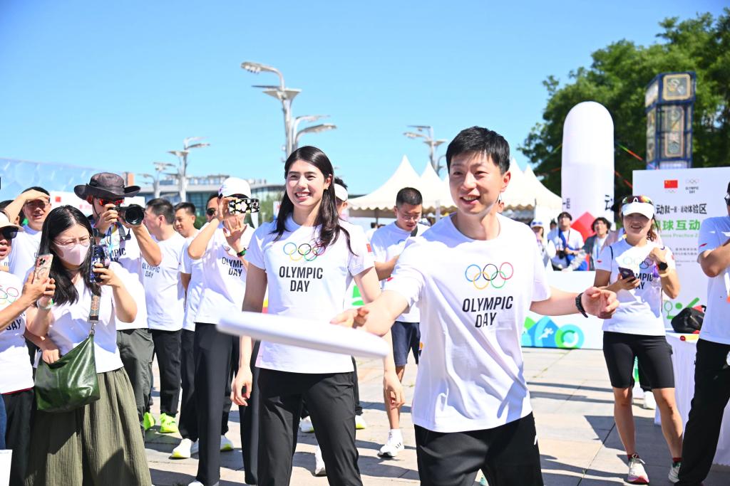 动就一起！中国多地举行全民健身活动迎接奥林匹克日(图2)